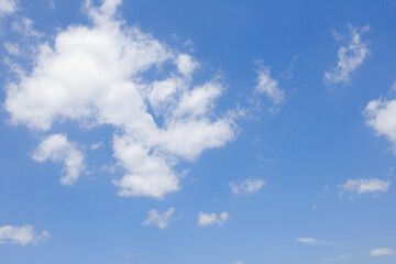Blue Sky with White Fluffy Clouds - Natural Background