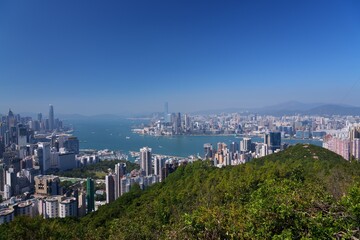 Hong Kong cityscape with Victoria Harbour. Sunny day city view from Braemar Hill.