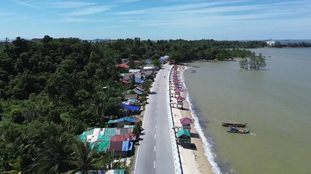 time lapse of cars go on the road in indah pangke beach, karimun regency, Riau Island - Indonesia