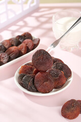 Xinjiang Dried Apricots on Spoon - Healthy Organic Dehydrated Fruit Snack Food