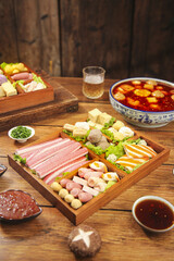 Hot Pot Feast with Meatballs and Wide Variety of Fresh Ingredients in Wooden Box