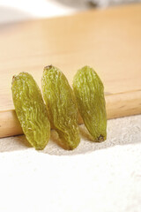 Xinjiang Emerald Green Dried Raisins on Wood - Premium Natural Healthy Snack Food