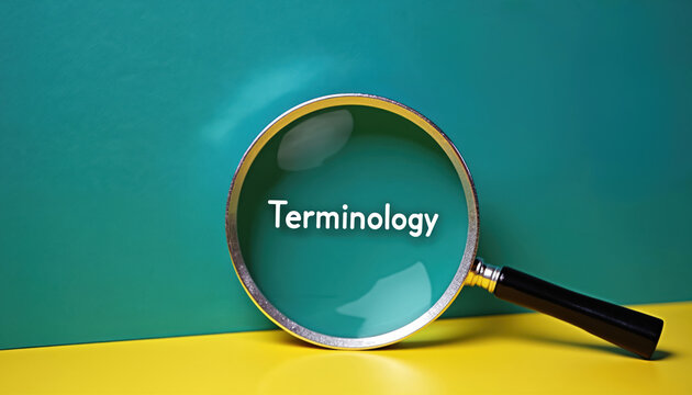 Magnifying glass focusing on terminology word on yellow background. Terminology concept with magnifier on colorful backdrop. Education and learning with magnifying glass.