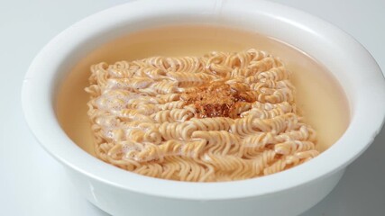 Instant noodles in a white bowl - Powered by Adobe