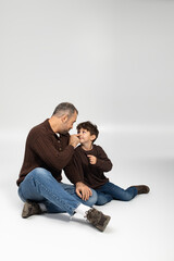 Cherished moments of a father and son sharing laughter and love in a calm indoor setting