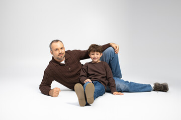Joyful moments shared between a father and his little son on a bright day