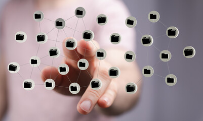 Hand interacting with connected folders network, symbolizing digital data and online storage concepts.