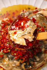 Delicious Fish Head in Spicy Red Chili Sauce - Traditional Asian Cuisine Cooking Preparation