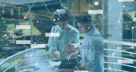 Leaning pair in shirt and blouse checking laptop at atrium glass rail, phone and network graphics