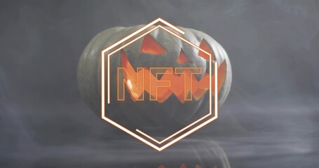 Glowing carved pumpkin sitting on reflective studio table, with neon hexagon and NFT letters in fog
