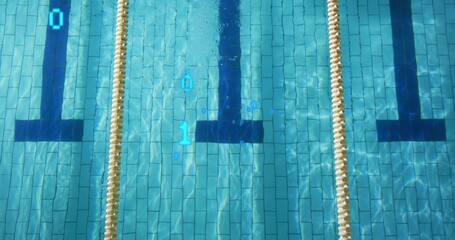 Showing center lane in lap pool, beige ropes, grouted tiles, black T, bubbles, blue overlay