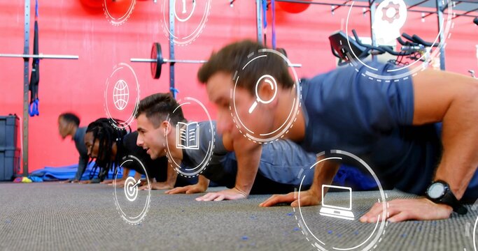 Performing four men doing push-ups in gym wearing athletic clothing, squat rack and overlay icons - Powered by Adobe