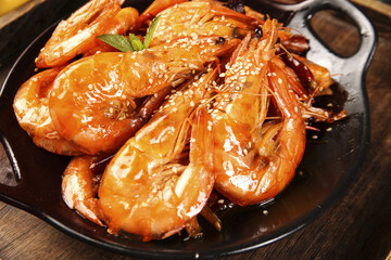 Spicy Qingdao Prawns with Sesame Seeds - Fresh Cooked Seafood Delicacy in Black Pan