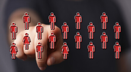 Hand pointing at red human icons representing a network, business team or social community. Digital connection,