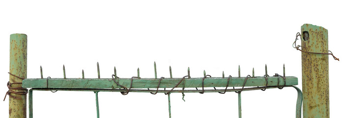 Old aged weathered green painted metallic grungy gate, large detailed upward driven nails closeup,...