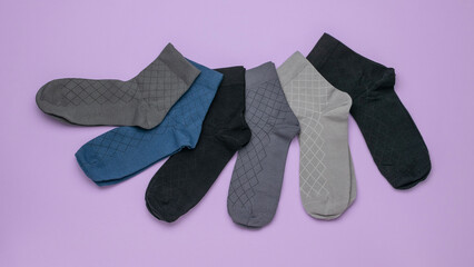 Colorful Variety of Cotton Socks on Purple Background - Fashionable and Comfortable Footwear