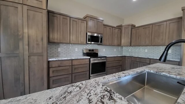 Contemporary Kitchen Features, Elegant Kitchen Equipped With Granite Surfaces And Stainless Fixtures