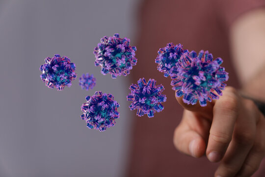 3D render of virus particles floating near a pointing finger, symbolizing contagion, health risks, and researc - Powered by Adobe
