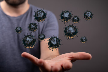 Visual concept of virus particles hovering above an outstretched hand. Ideal for medical or science content. C