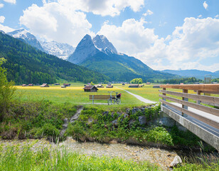 Rest area with bench next to a stream, halfway along cycle path between Garmisch and Grainau.