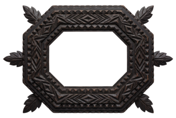 An antique octagonal picture frame made of dark carved wood. Vintage folk art object with a geometric and leaf pattern isolated on white.