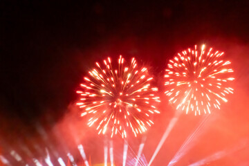 Red and white fireworks display at night