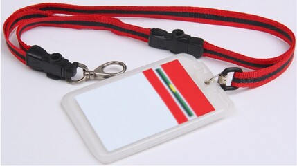 Close-up of an ID badge on a lanyard against a white backdrop