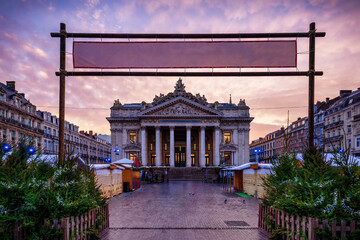 The Christmas Market at the Bourse, Brussels, Belgium, during a beautiful winter sunrise without people