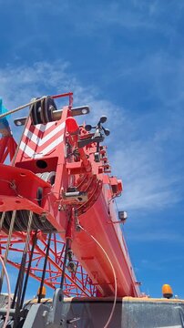 Crane parked with wind anemometer moving in the desert