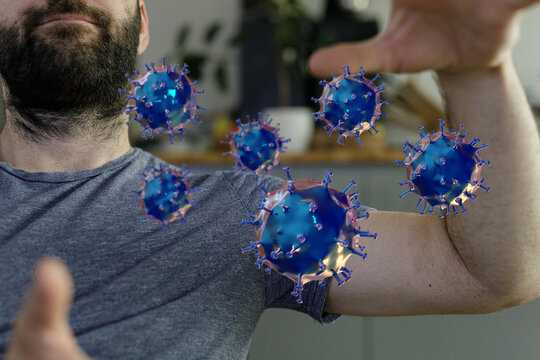 Conceptual image of a man and 3D rendered coronaviruses showing health and healthcare, disease, virus, and imm