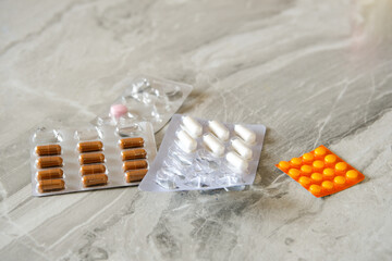 different blisters with tablets on the table