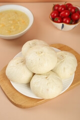 Handmade Fresh Meat Buns with Scallion Soup and Cherry Tomatoes Traditional Asian Food