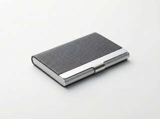 Sleek corporate business card holder combining black leather texture and polished stainless steel trim isolated on white