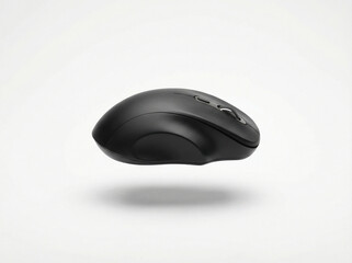 Ergonomic matte black wireless computer mouse with smooth curves suspended and casting a soft shadow on white