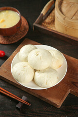 Handmade Pork Buns with Scallion on Wooden Board - Traditional Asian Steamed Dumplings