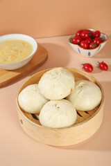Handmade Pork Buns with Fresh Scallion Stuffing in Bamboo Steamer Traditional Asian Cuisine