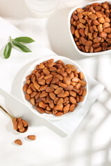 Pine Nuts in White Bowls on Marble Surface - Healthy Organic Kernels and Nuts