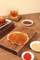 Homemade Spiced Henan Grilled Skewers with Traditional Chinese Sauces on Wooden Boards