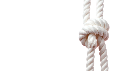 White rope tied in a complex knot, against a solid black backdrop, close-up view