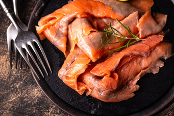 Salted sliced salmon fish with herbs