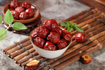 Xinjiang Dried Jujube Dates in Bowls on Bamboo Mat - Traditional Chinese Superfood