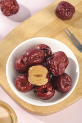 Hotan Red Jujube Dates from Xinjiang China - Dried Traditional Superfruit in Bowl
