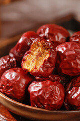 Dried Red Jujube Dates from Hotan Xinjiang China in Wooden Bowl Showing Interior Flesh