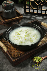 Fresh Mung Bean Porridge in Traditional Chinese Farmhouse Style Bowl with Green Kernels
