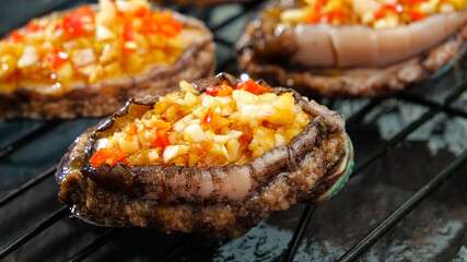 Fresh Abalone Steamed with Fragrant Garlic and Vegetables on Grill
