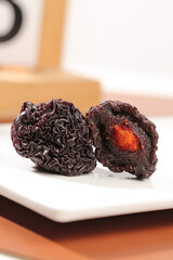 Chinese Candied Dried Plums Traditional Asian Fruit Snack on White Plate