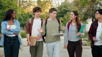 Group of student friends walking on college campus, chatting and laughing after university classes - Powered by Adobe
