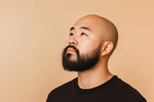 Bald Asian Man Looking Up