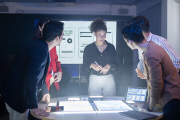 Diverse team of developers collaborating reviewing UX UI design project and discussing digital marketing and web development at meeting. creative AI solution project. Application and program design