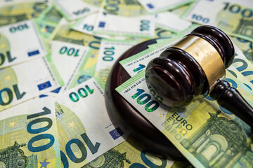 100 Euro banknotes and judge gavel concept of law and corruption control